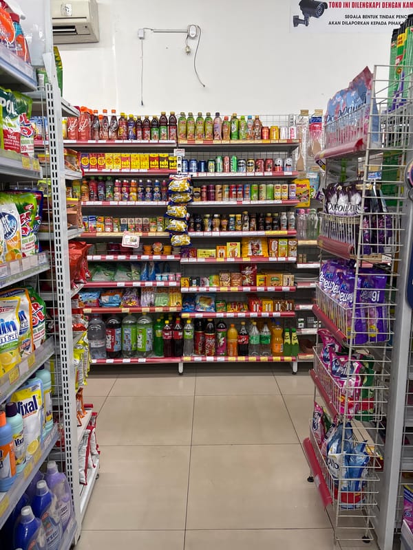 Unknown person documents Alfamidi store sections in Tangerang