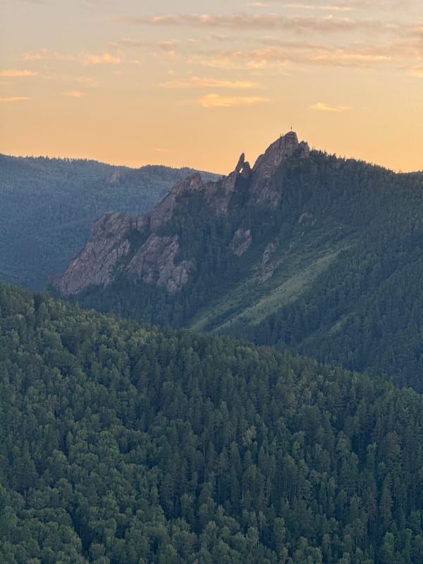 Sunset across Stolby Nature Reserve and Krasnoyarsk's hillside panoramas