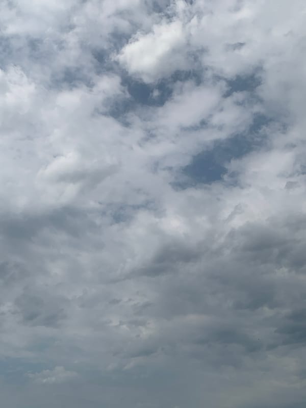 Shifting skies over Kolomyia on a variable summer morning