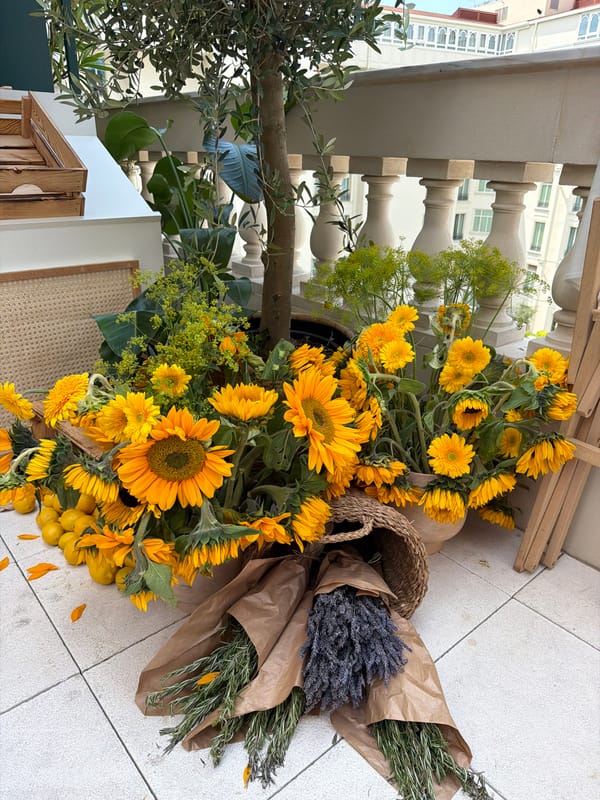 Wellness brand pop-up with flowers, coffee, and Cymbiotika in Cannes