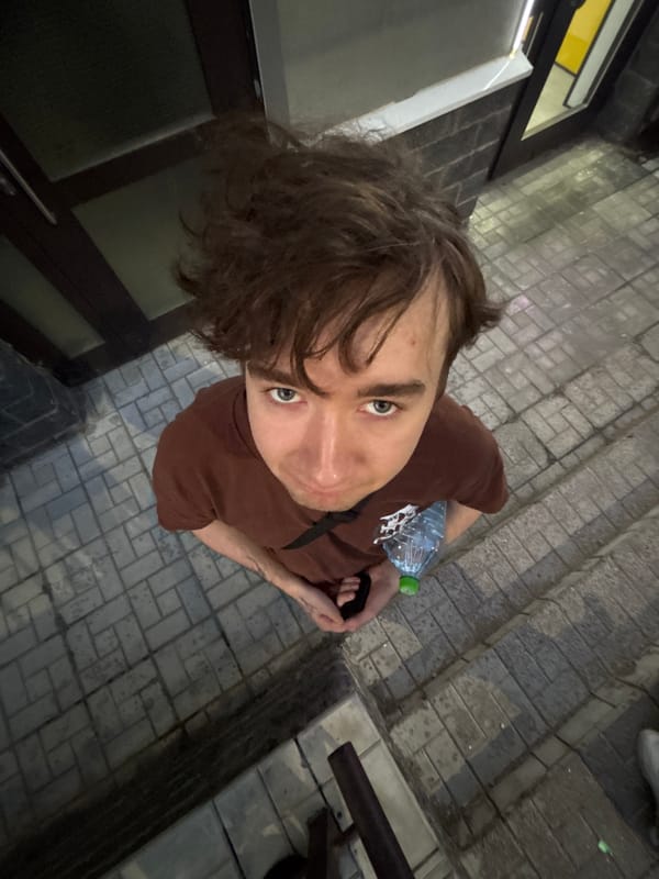Friends messing around with camera angles in an urban setting