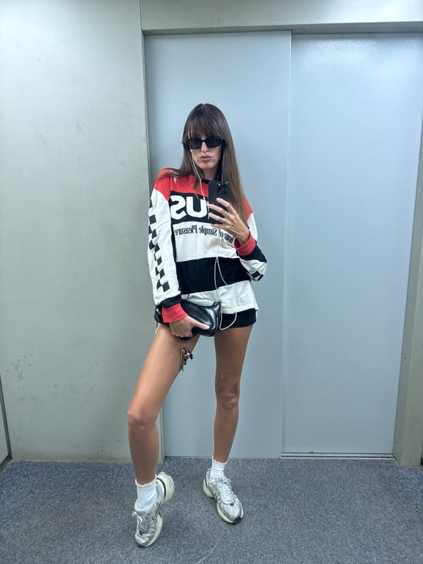 Mirror selfies in Moscow, same bold striped shirt, two locations