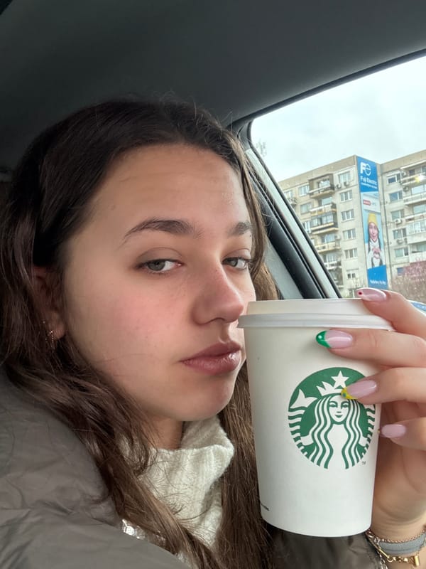 Woman takes morning selfies with coffee in Sofia