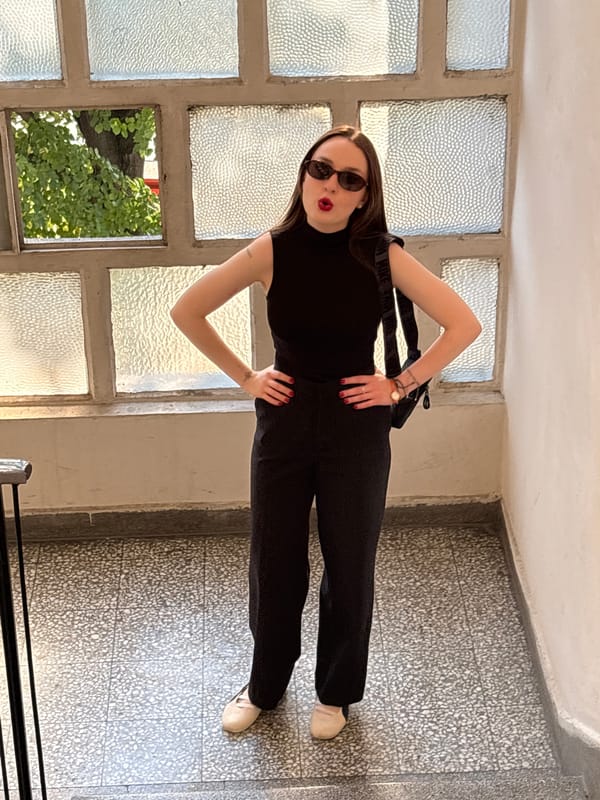 Indoor portraits around a Belgrade stairwell, same outfit, same day.