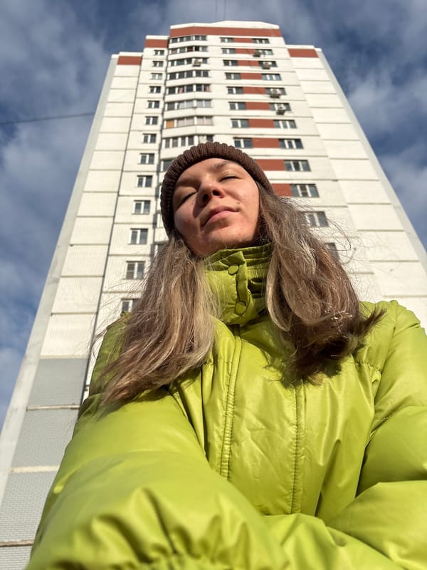 Woman photographed outside apartment building in Izhevsk, Russia