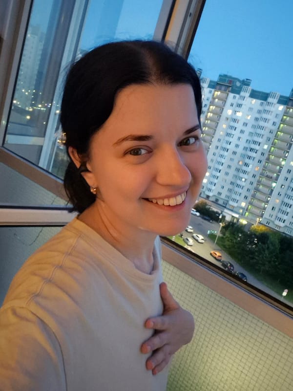 Window selfies over Saint Petersburg streets at dusk