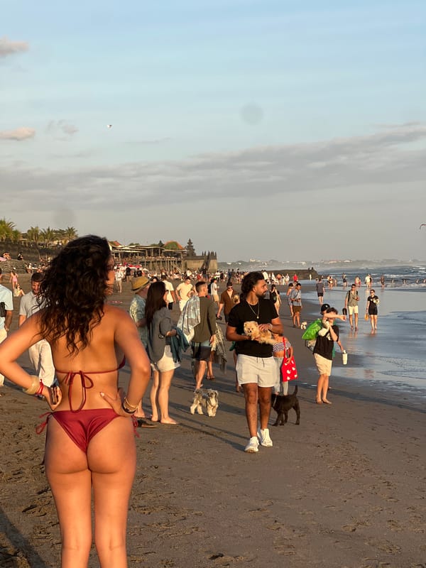 North Kuta beach at golden hour, crowds soaking up the sunset