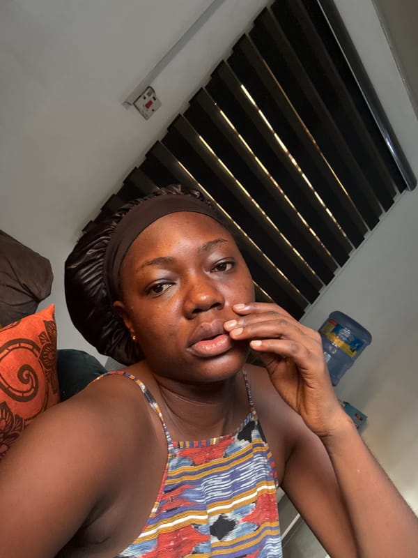 Woman takes morning selfies in Abuja home