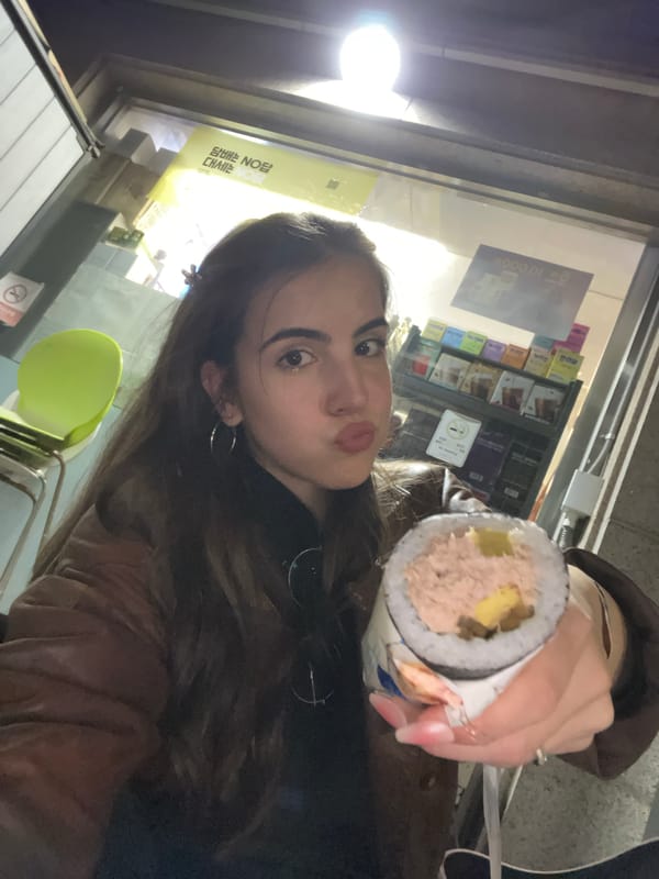 Woman holds tuna kimbap outside Seoul convenience store