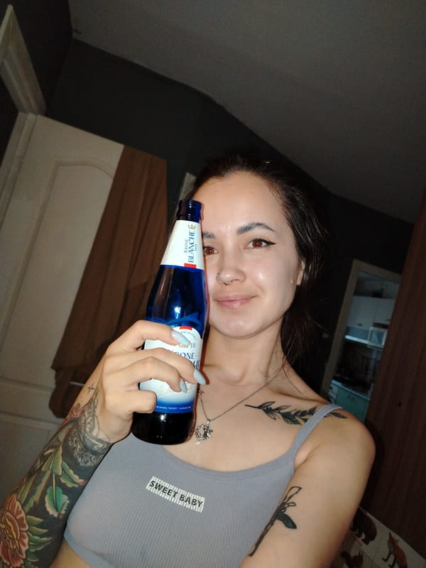 Woman takes selfies during afternoon gathering in Noviy, Russia