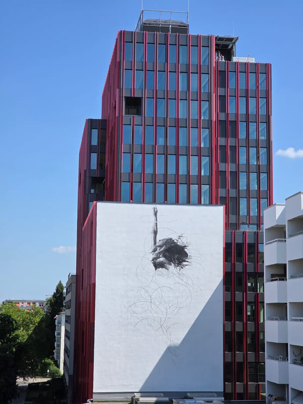 Police presence outside a Berlin cafe amid bold modern architecture