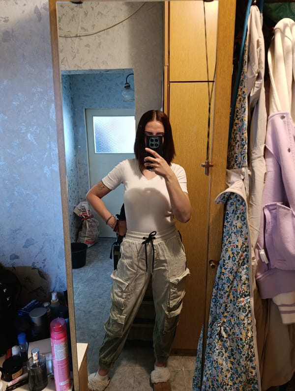 Woman takes mirror selfie in Plovdiv apartment with Frozen doll