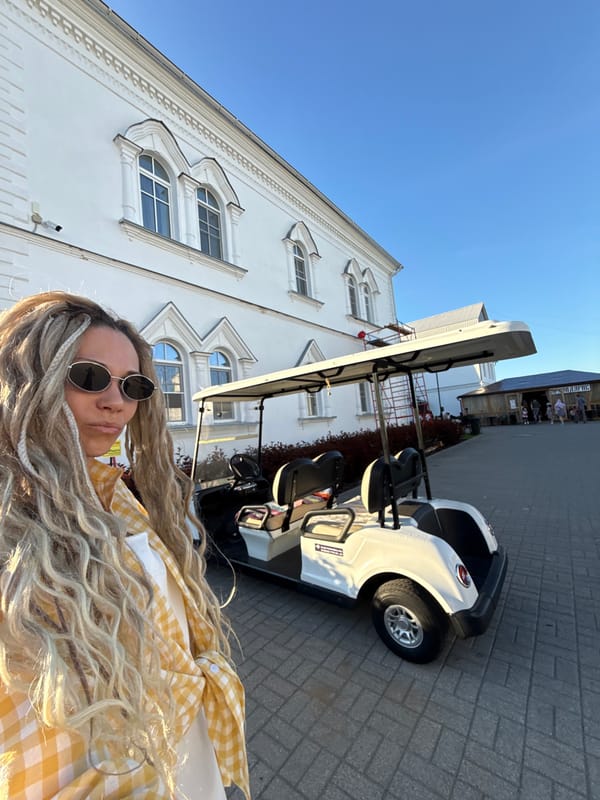 Woman photographed at multiple Yaroslavl locations during afternoon outing