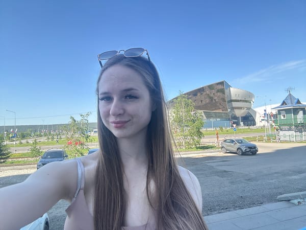 Young woman documents morning cafe outing through selfies and food photos