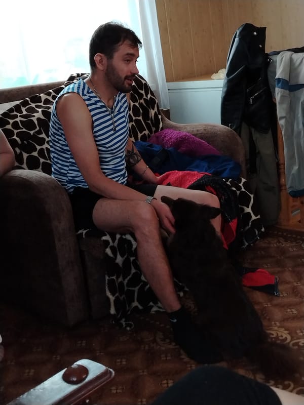 Man relaxes in armchair at Russian home