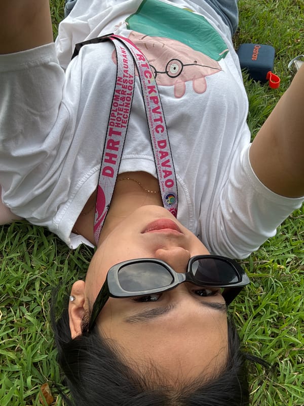 Lazy morning hangout on a Davao City grassy field with a dachshund