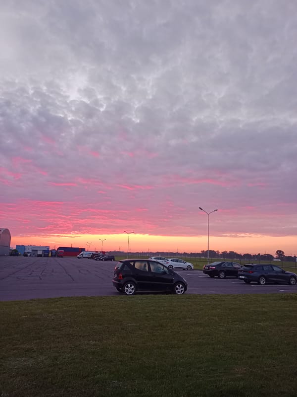 Vivid dusk sky over a Belarusian parking lot