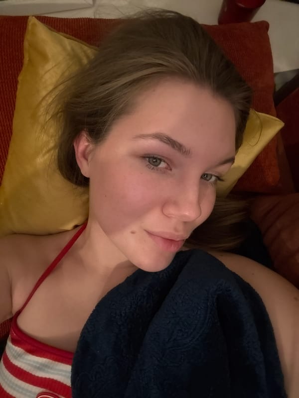 Woman rests on couch in Belgrade suburb