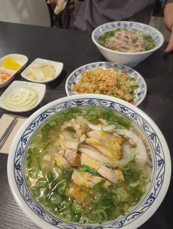 Dinner and street food scene outside Tiger Dim Sum at night