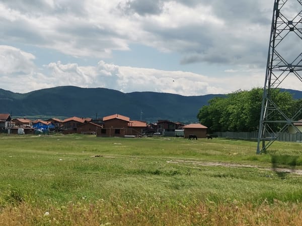 Rural landscapes and mural building captured in Ihtiman, Bulgaria