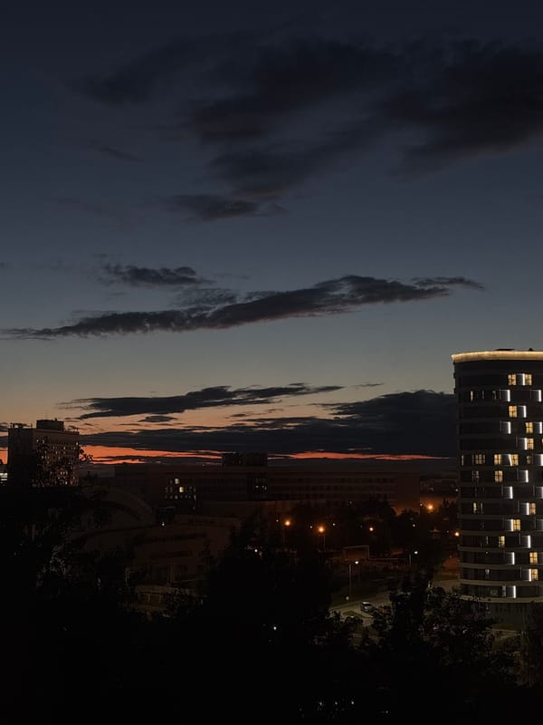 Twilight sky transitions over Minsk cityscape