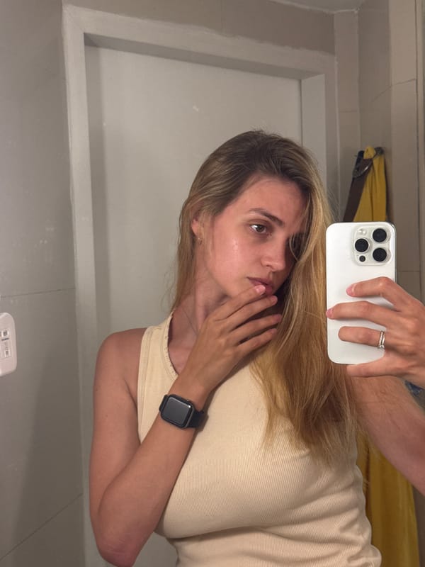 Woman takes selfies in Patong, Thailand evening scene