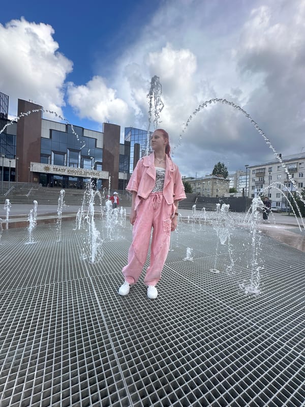 Woman in pink photographed at multiple Saratov locations