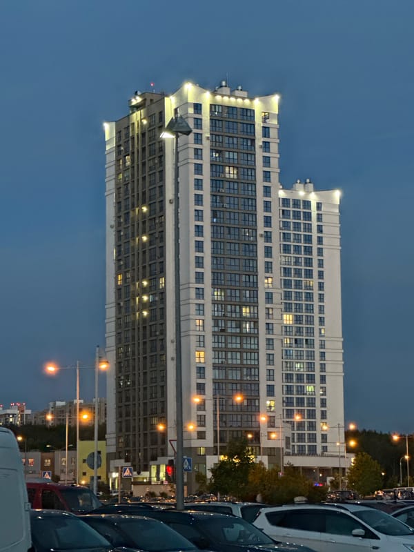 Evening architectural photography session captures modern Minsk buildings at twilight