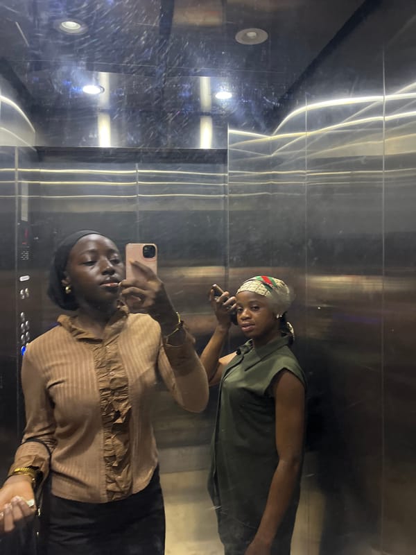 Women take elevator selfie in Karum Nigeria morning