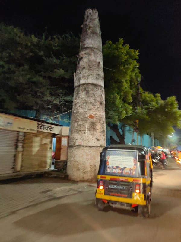 Festive night streets in Chhatrapati Sambhajinagar, traffic rolling through