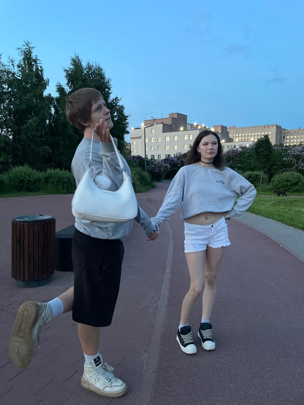 Couple enjoys evening walk in Sinyavino park