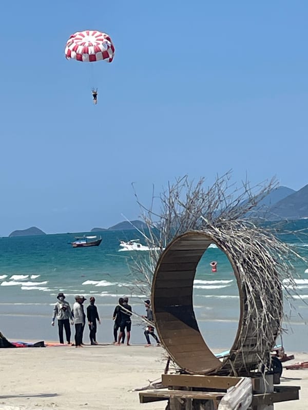 Morning beach scene with aircraft activity in Dong Ninh Hoa