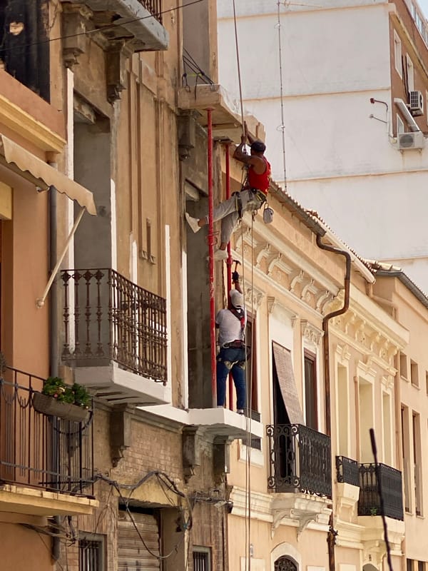 Street-level slice of a Valencia neighborhood on a June morning