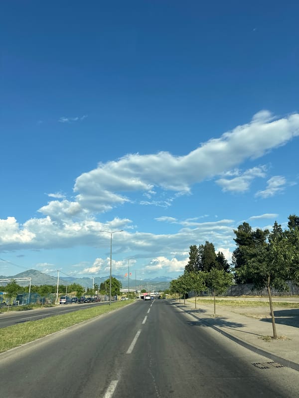 Street scene captured in Podgorica showing road toward tunnel