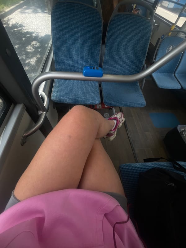 Person in pink hoodie travels through Moscow during lunch hour