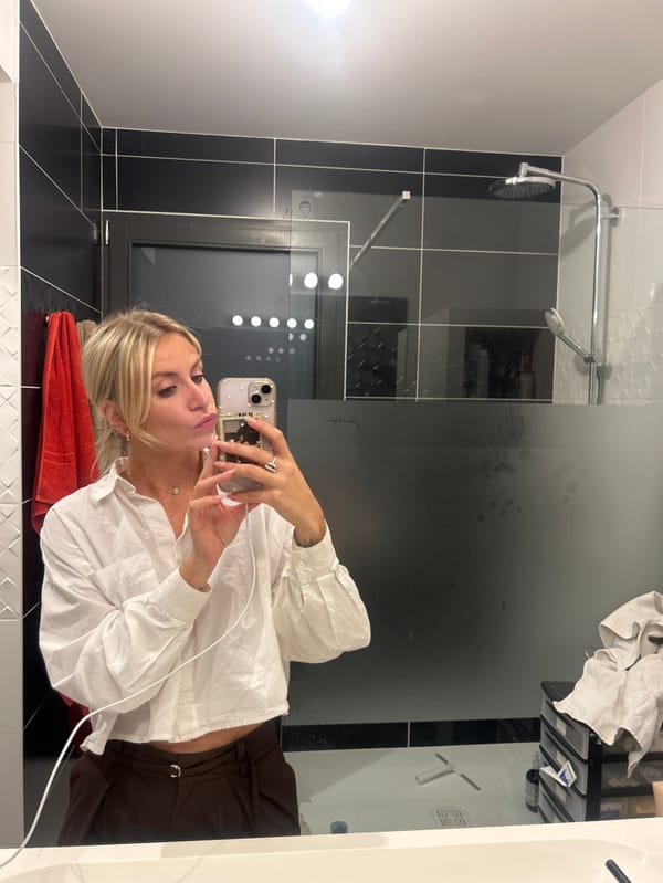 Woman takes bathroom mirror selfies in Chambœuf, France