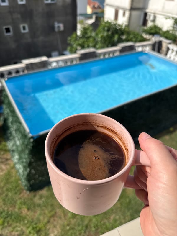 Morning coffee by swimming pool in Bijela, Montenegro