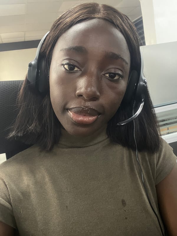 Woman working at office desk observed in Karum, Nigeria