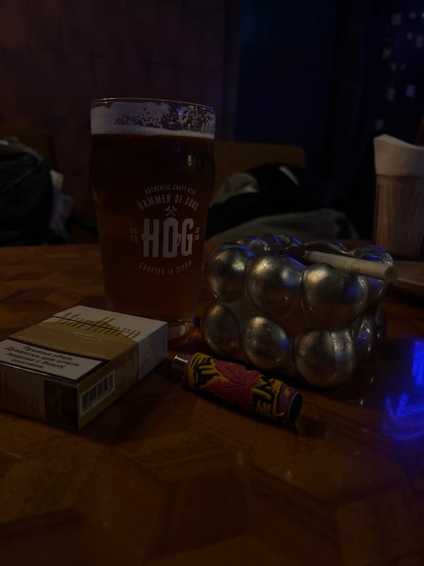 Bar patron drinks craft beer, smokes in Belgrade establishment