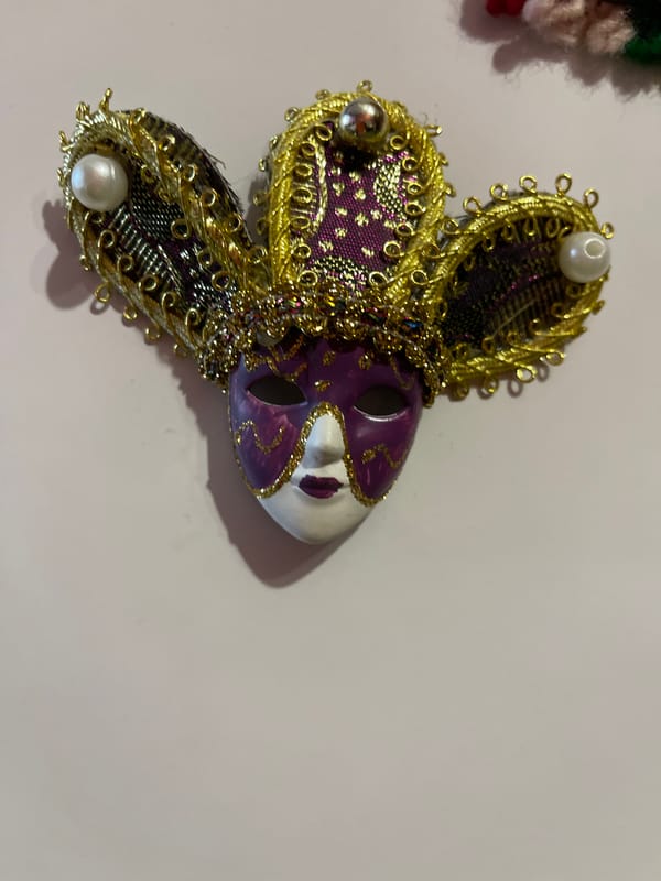 Decorative mask and figurine photographed in Elhovo, Bulgaria