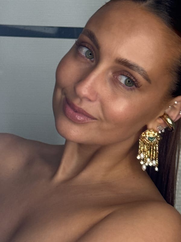 Woman photographed wearing gold ear jewelry in Chaikovsky, Russia