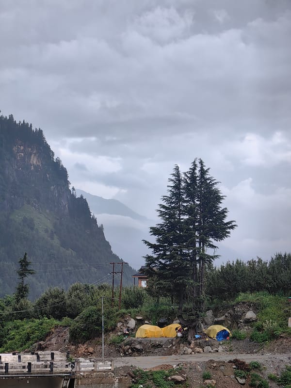 Stormy conditions and rushing floodwater at a Palchan campsite