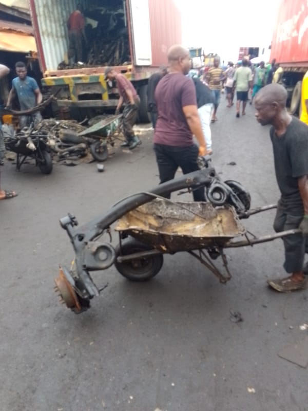 Daily street life and mechanics work documented in Onitsha