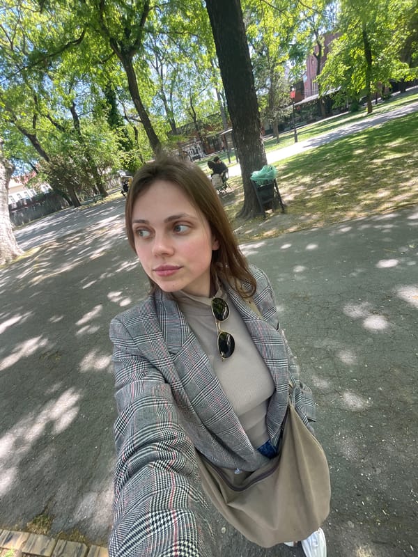 Woman photographs herself in Subotica park during morning outing