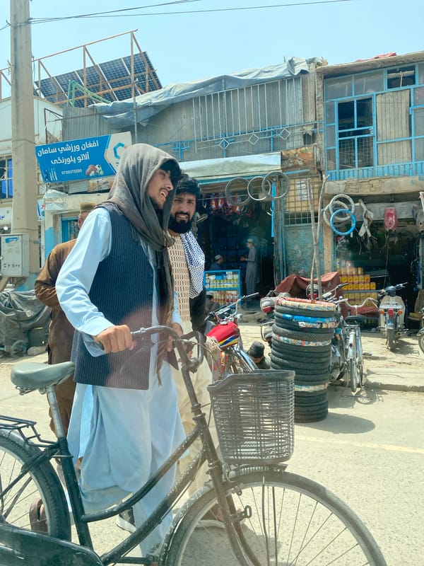 Everyday street life along a busy Kandahar commercial strip