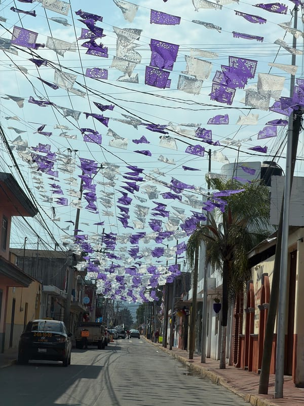 Papel picado banners decorate San Andrés Cholula street