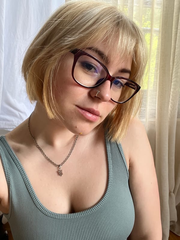 Woman resting by window in Boreti, Montenegro