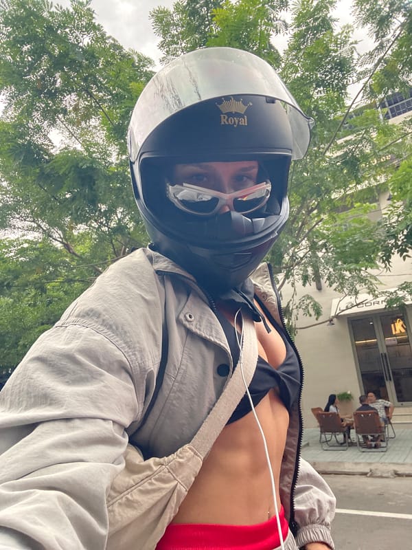 Helmeted rider geared up in Phu Thuy Ward, Vietnam