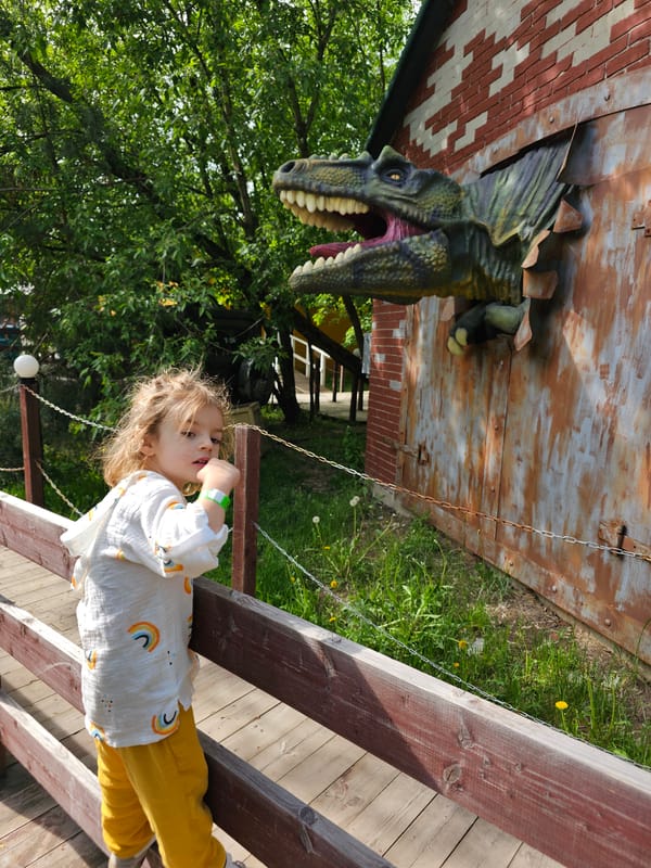 Child plays at dinosaur-themed park in Khimki, Russia