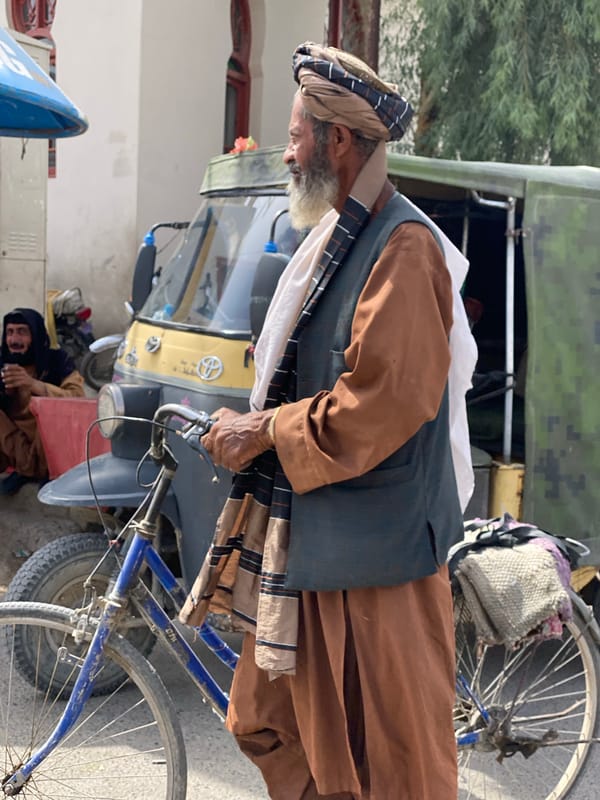 Everyday street life moving through central Kandahar
